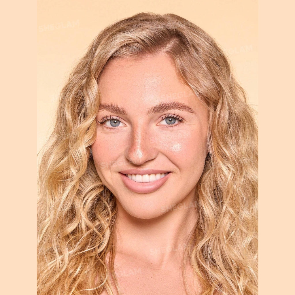 SHEGLAM Dew & Done Skin Tint with SPF20 in Chantilly shade, dewy light-to-medium coverage skin tint tube on a clean background.
