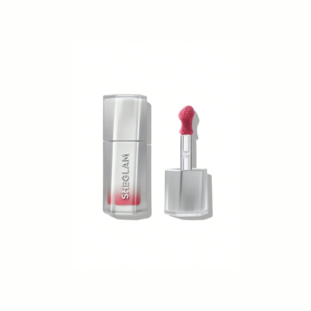 SHEGLAM Glass Lock Air Gloss – That's My Jam, rich berry-pink high-shine lip gloss in a sleek tube with a glassy, mirror-like finish on a clean background.

