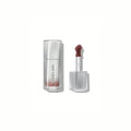 SHEGLAM Glass Lock Air Gloss – Sepia Kiss, soft brown-rose nude high-shine lip gloss in a sleek tube with a glassy, mirror-like finish on a clean background.
