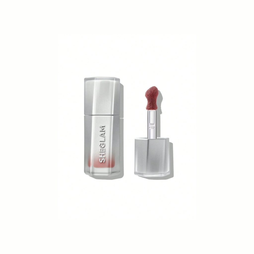 SHEGLAM Glass Lock Air Gloss – Honey Glaze shade in sleek tube, hydrating mirror-shine lip glaze with warm honey-gold glossy finish
