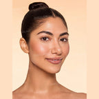 SHEGLAM Dew & Done Skin Tint with SPF20 in Acorn shade, dewy light-to-medium coverage skin tint tube on a clean background.
