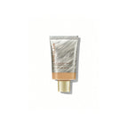 SHEGLAM Dew & Done Skin Tint with SPF20 in Acorn shade, dewy light-to-medium coverage skin tint tube on a clean background.
