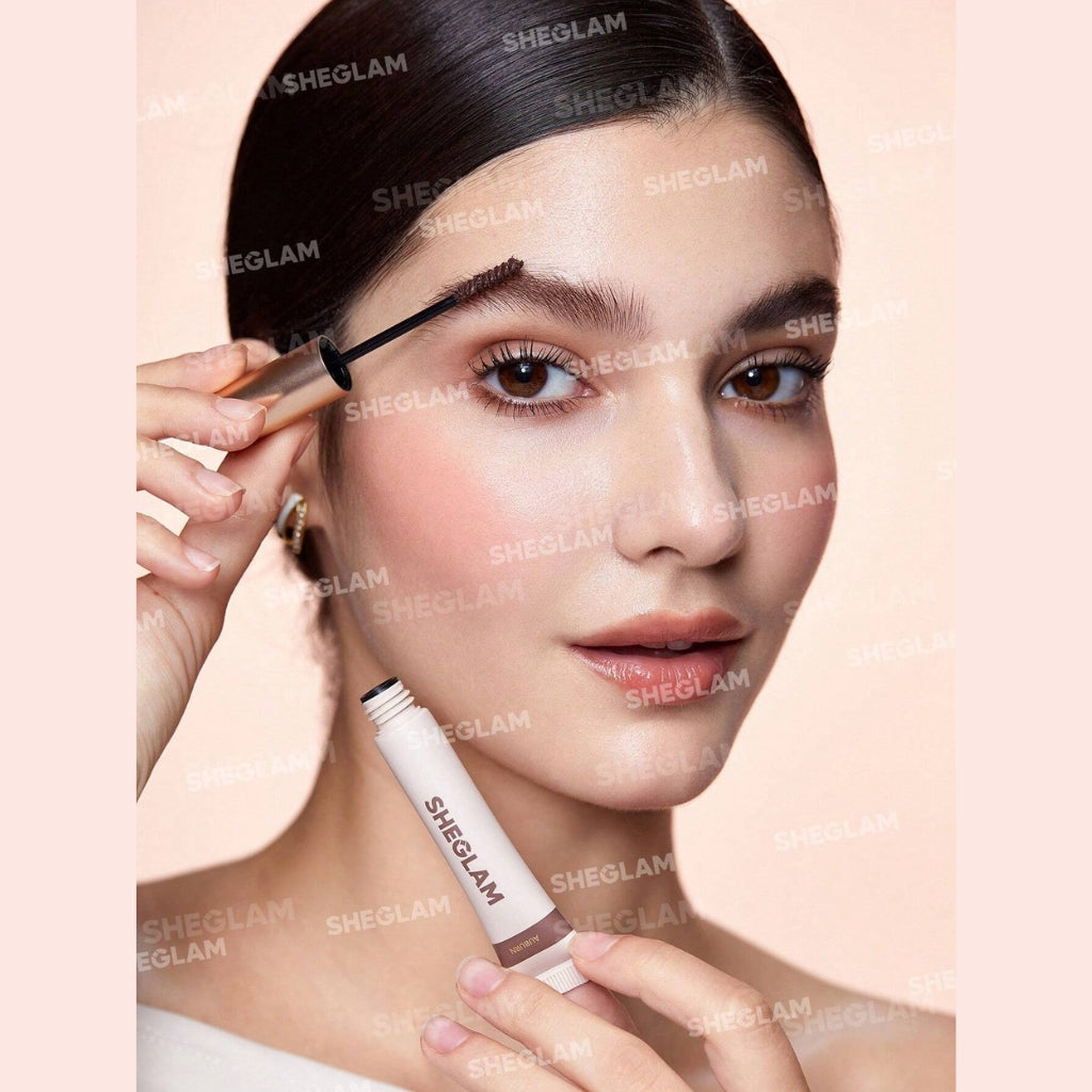 SHEGLAM Hold 'Em Up Tinted Brow Gel in Auburn shade for defined, lifted brows with a natural tinted hold.
