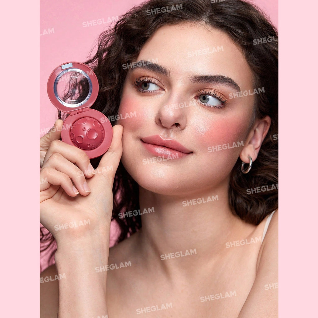 SHEGLAM Lunar Orbit Blush Ball in Gravity, hemispherical cream blush ball on a clean background.
