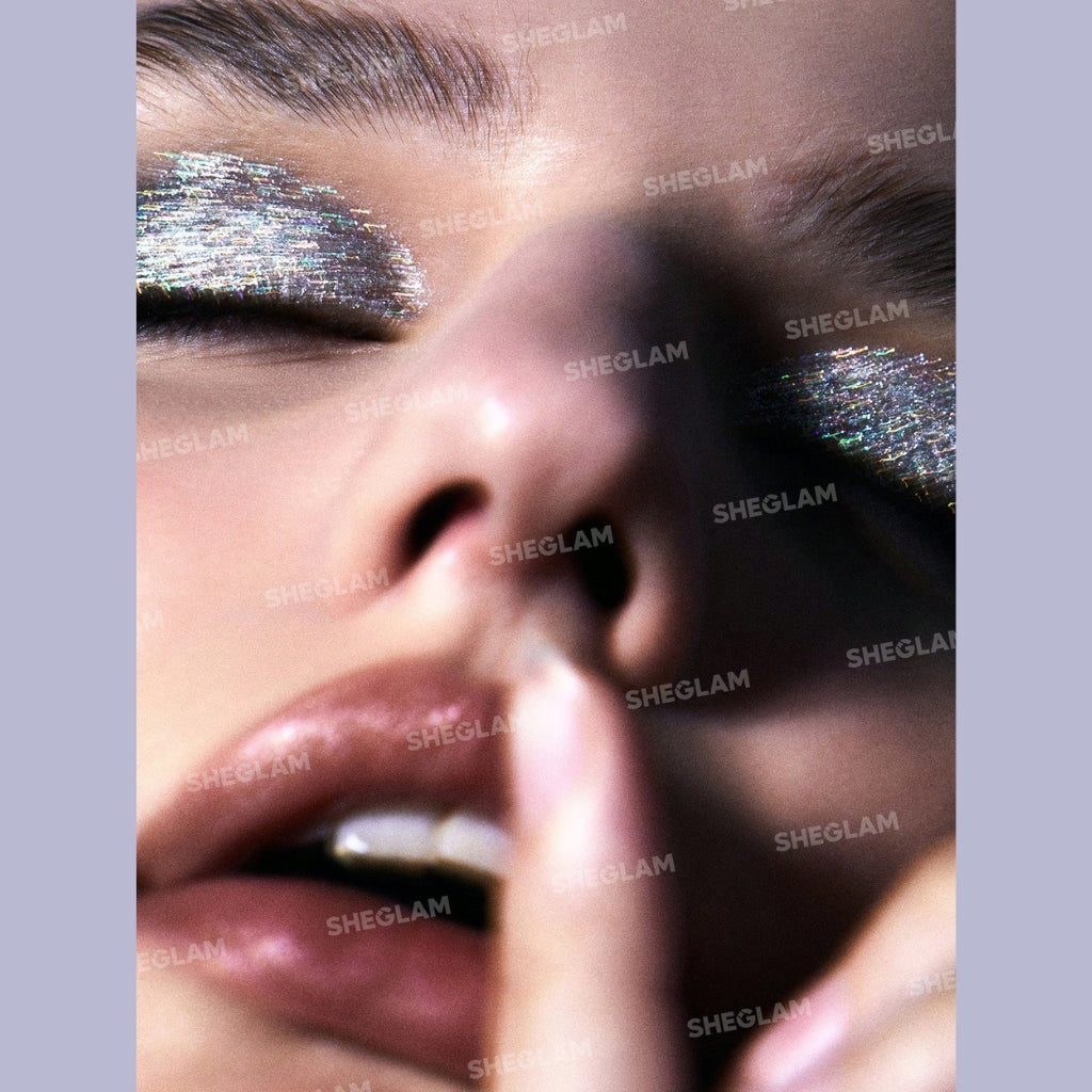 SHEGLAM Insta-Party Glitter Liner in Disco Ball, silver liquid glitter eyeliner with precise silicone tip and long-wearing sparkle finish.
