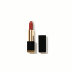SHEGLAM Matte Allure Lipstick – Crimson Suede, deep crimson-red matte bullet lipstick with a velvety finish on a clean background.

