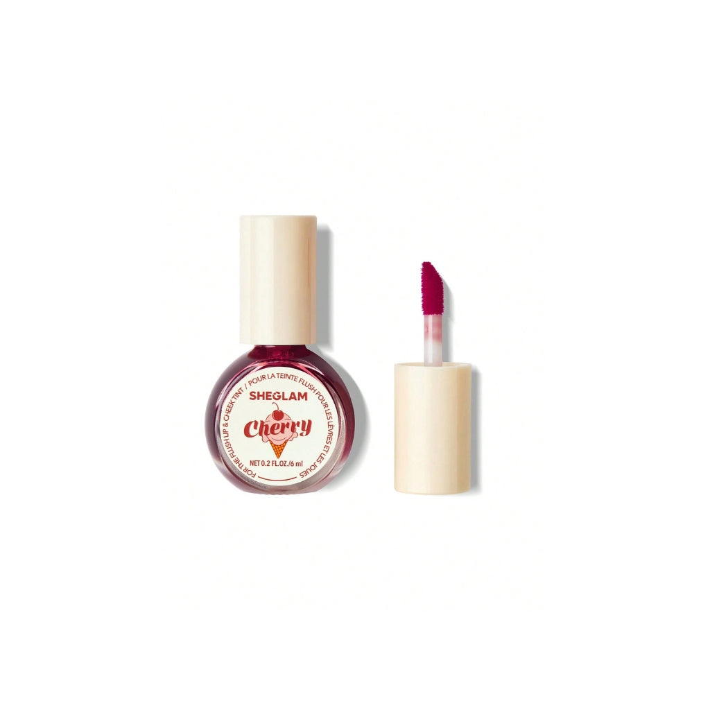 SHEGLAM For The Flush Lip & Cheek Tint – Cherry Picked, vibrant cherry-pink liquid tint in a sleek tube for lips and cheeks on a clean background.
