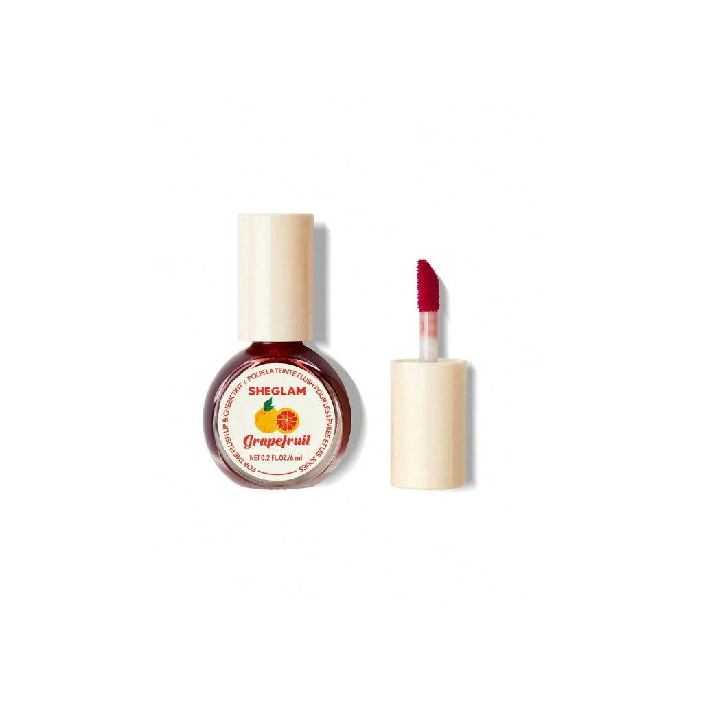 SHEGLAM For The Flush Lip & Cheek Tint – Fruit Punch, juicy grapefruit-red liquid tint in a sleek tube for lips and cheeks on a clean background.
