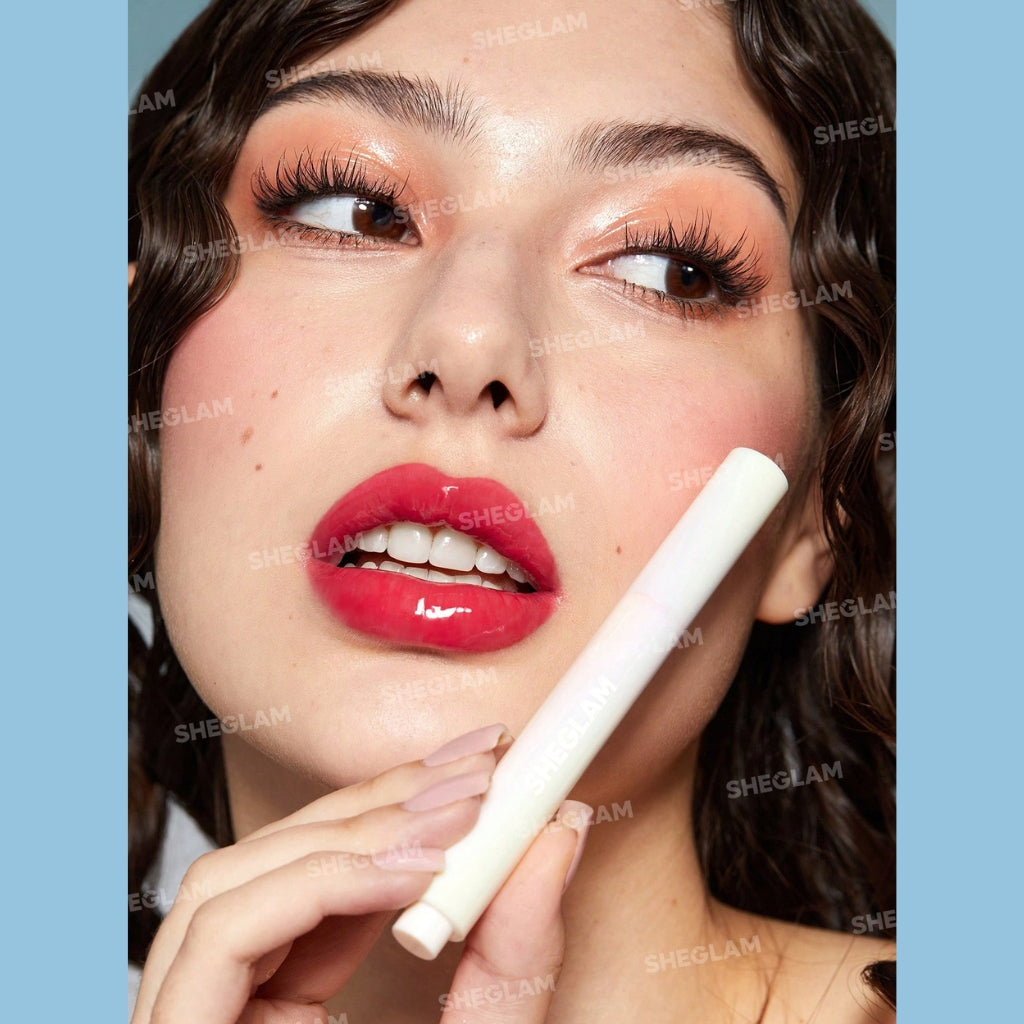 SHEGLAM Pout-Perfect Shine Lip Plumper Hot Stuff solid gloss stick with coconut oil for high-shine lips.
