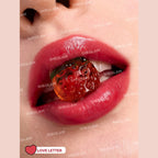 Hello Kitty x SHEGLAM Be My Baby Hydrating Lipstick in Love Letter shade with heart-core bullet and cute ring detail.
