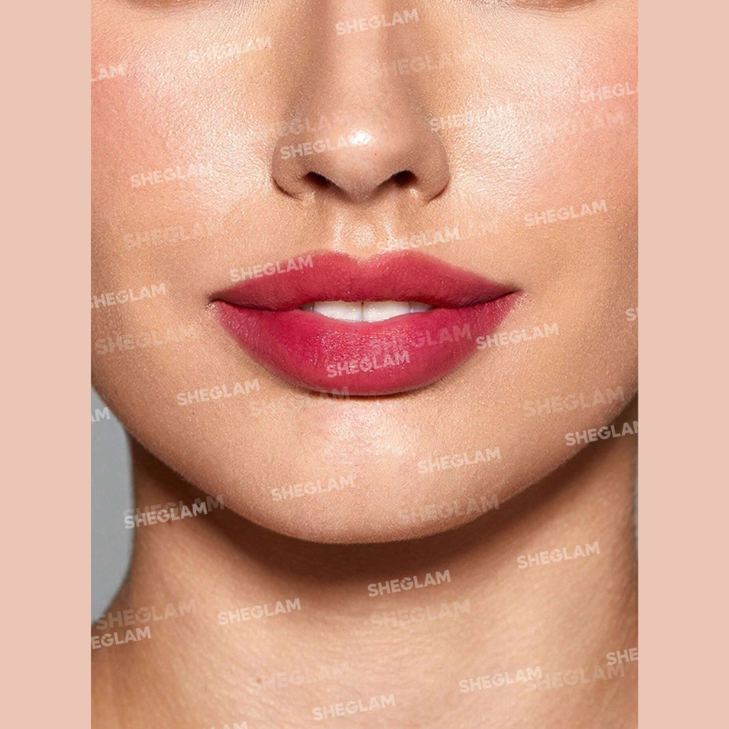 SHEGLAM For The Flush Lip & Cheek Tint – It's Chili, warm rosy-pink liquid tint in a sleek tube for lips and cheeks on a clean background.
