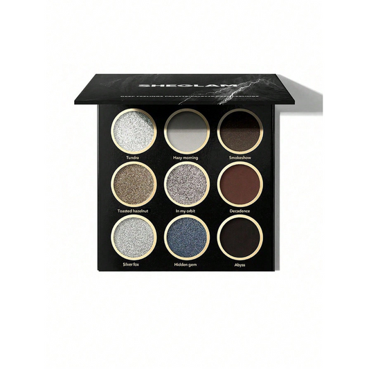 SHEGLAM Deep Feelings Palette with 9 smoky shades in greys, silvers, browns, black and chrome blue, featuring matte, shimmer and glitter finishes
